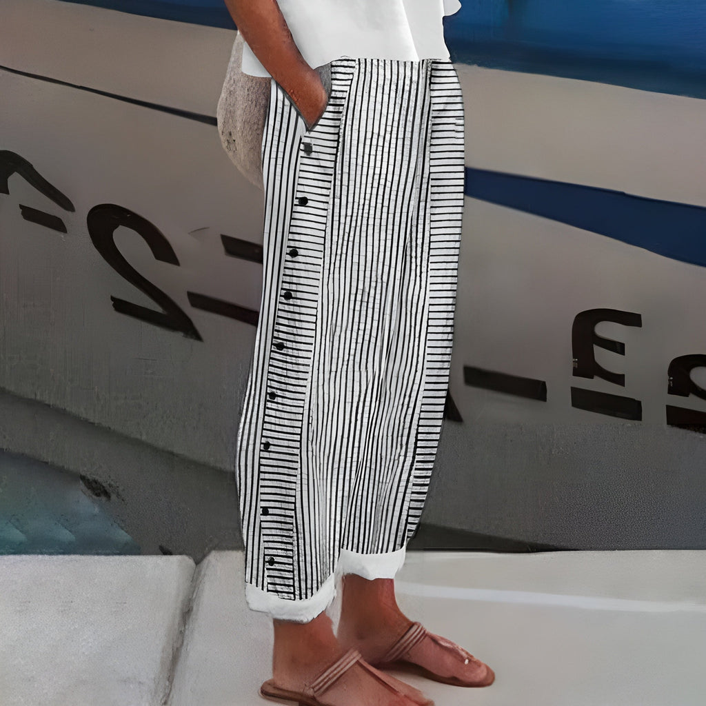 Women's stripe panel button detail trousers, side view