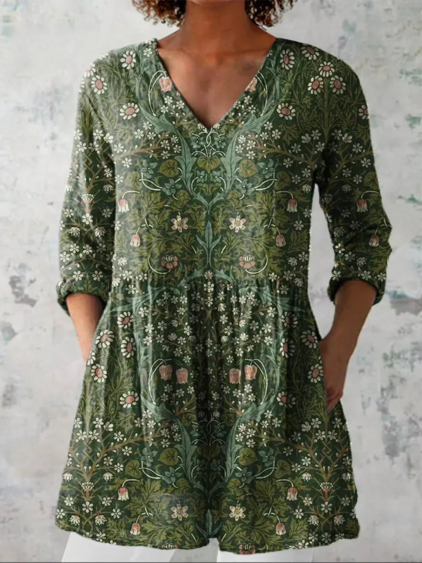 Floral print V-neck top with 3/4 sleeves in green, front view