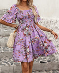 Floral smocked puff sleeve mini dress in purple, front view