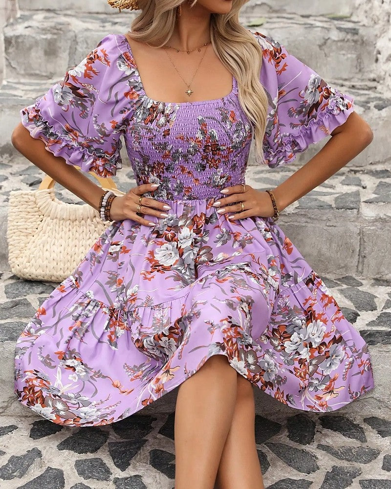 Floral smocked mini dress in navy, side view