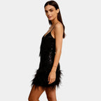 Black sequin feather hem mini dress – spaghetti strap side view