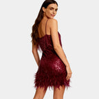 Women's burgundy sequin party dress with feather hem – back view