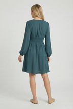 Women's elegant pleated midi dress, close-up of sleeve and neckline detail