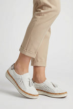 Women's perforated slip-on shoes, sole view showing flat rubber sole