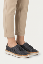 Women's slip-on casual shoes styled with trousers, full length