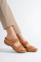 Women's casual sandals styled with summer outfit, full length