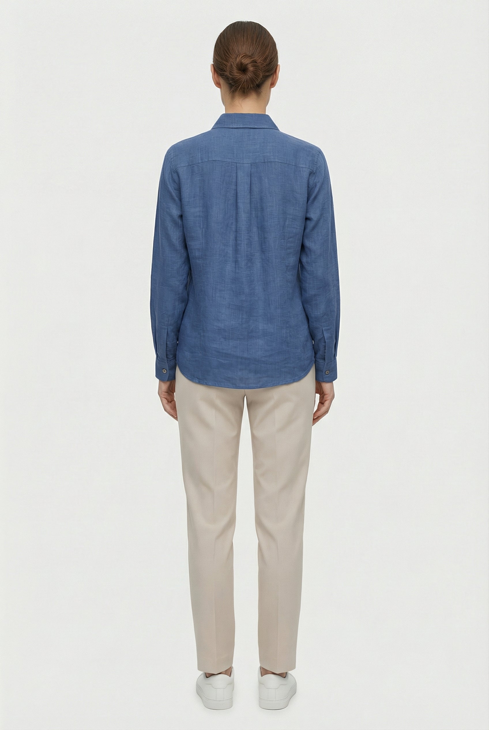 Women's cotton casual shirt tucked into trousers, full length