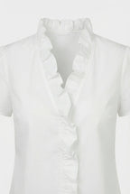 Women's casual blouse, side view showing soft fabric drape