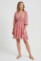 Women's ruffled hem mini dress, side view showing silhouette