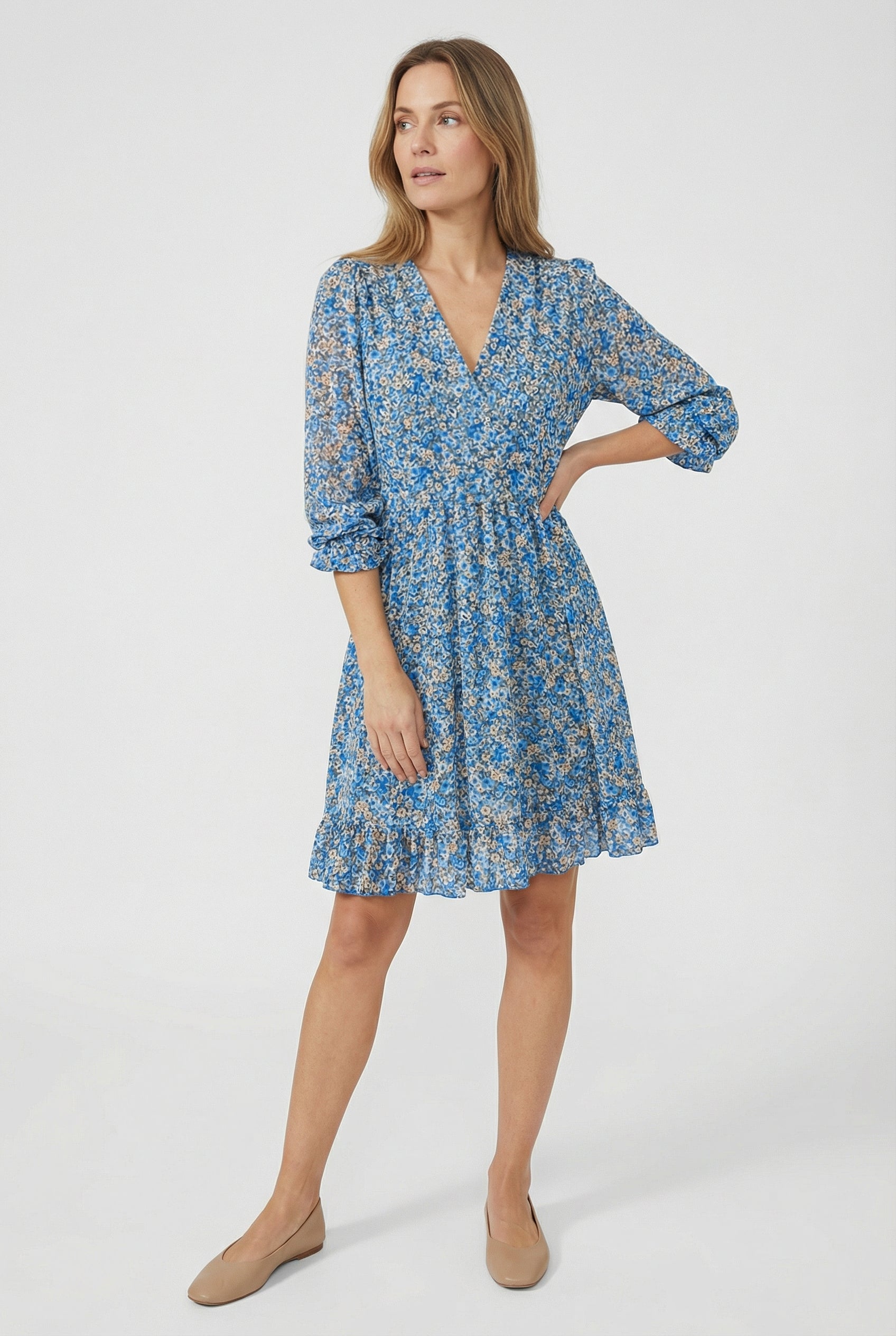 Women's V-neck ruffled mini dress styled for a casual summer occasion