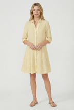 Women's striped A-line dress styled with sandals, casual summer look