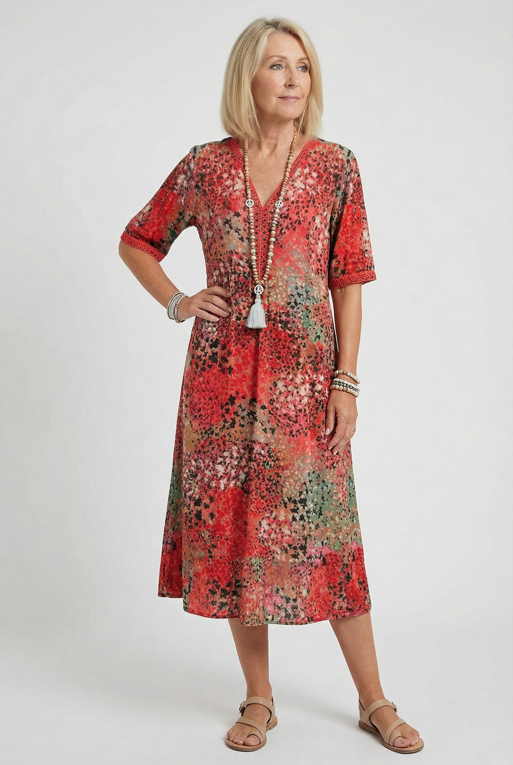 Women's abstract print midi dress with tiered hem, side view