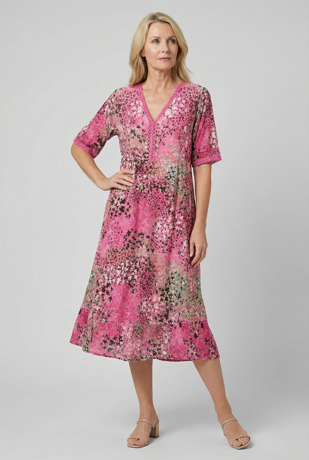 Women's V-neck tiered midi dress, styled for a beach occasion