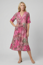 Women's V-neck tiered midi dress, styled for a beach occasion