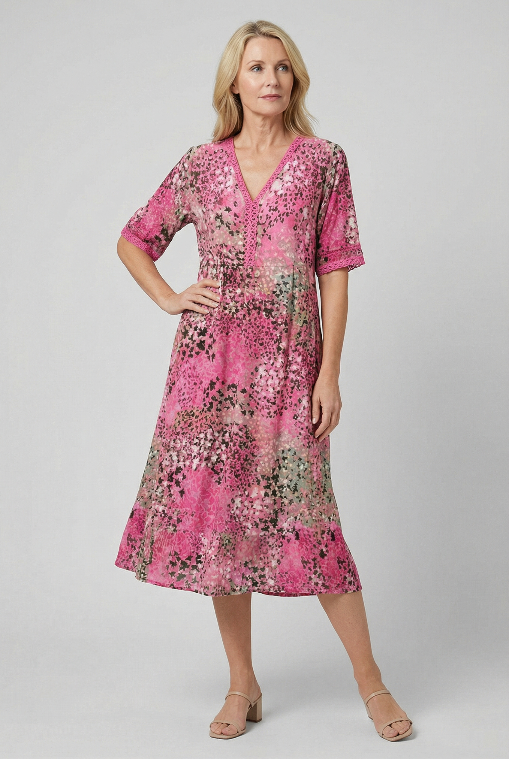Women's V-neck tiered midi dress, styled for a beach occasion