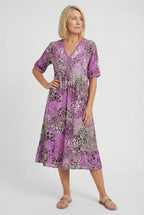 Women's flowy abstract print dress, full length side view