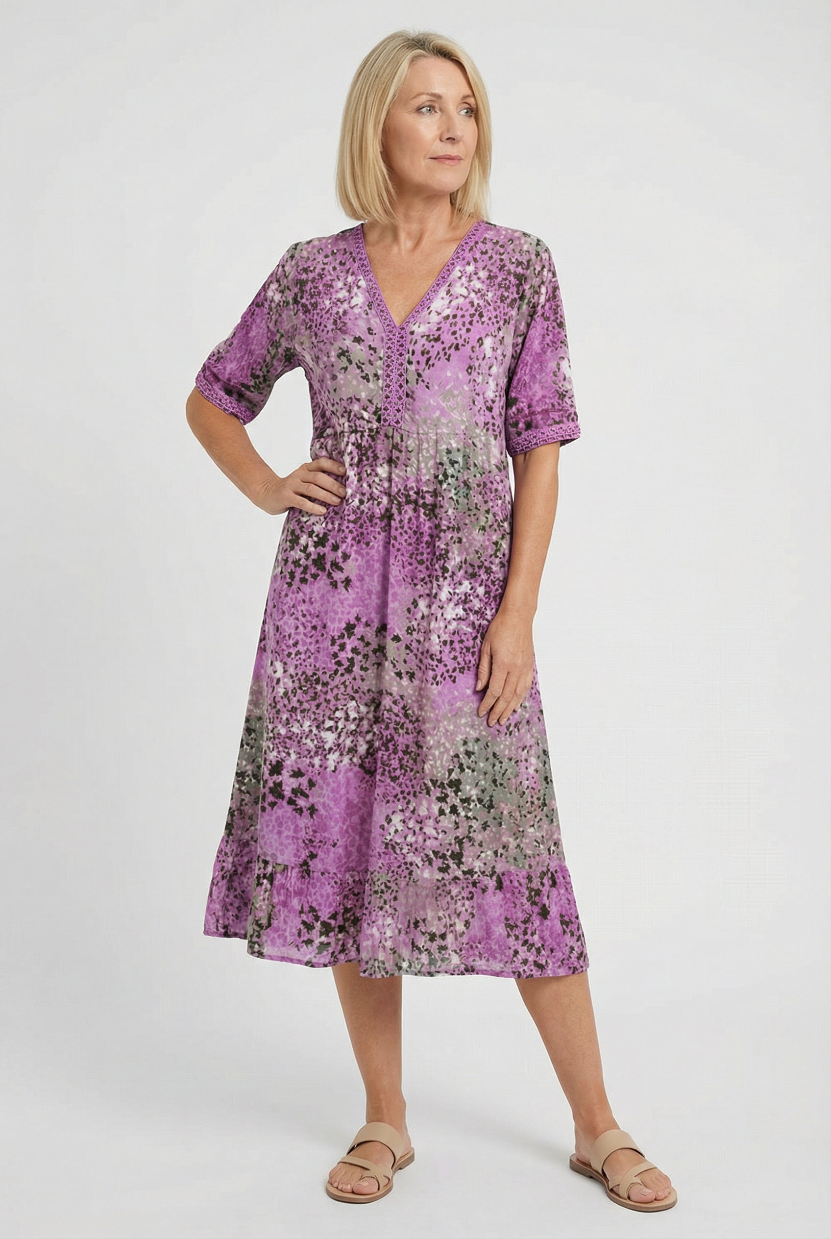Women's flowy abstract print dress, full length side view
