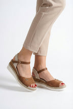Women's espadrille flats with buckled ankle strap, side view