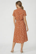 Women's floral waistband dress, close-up of floral print and fabric