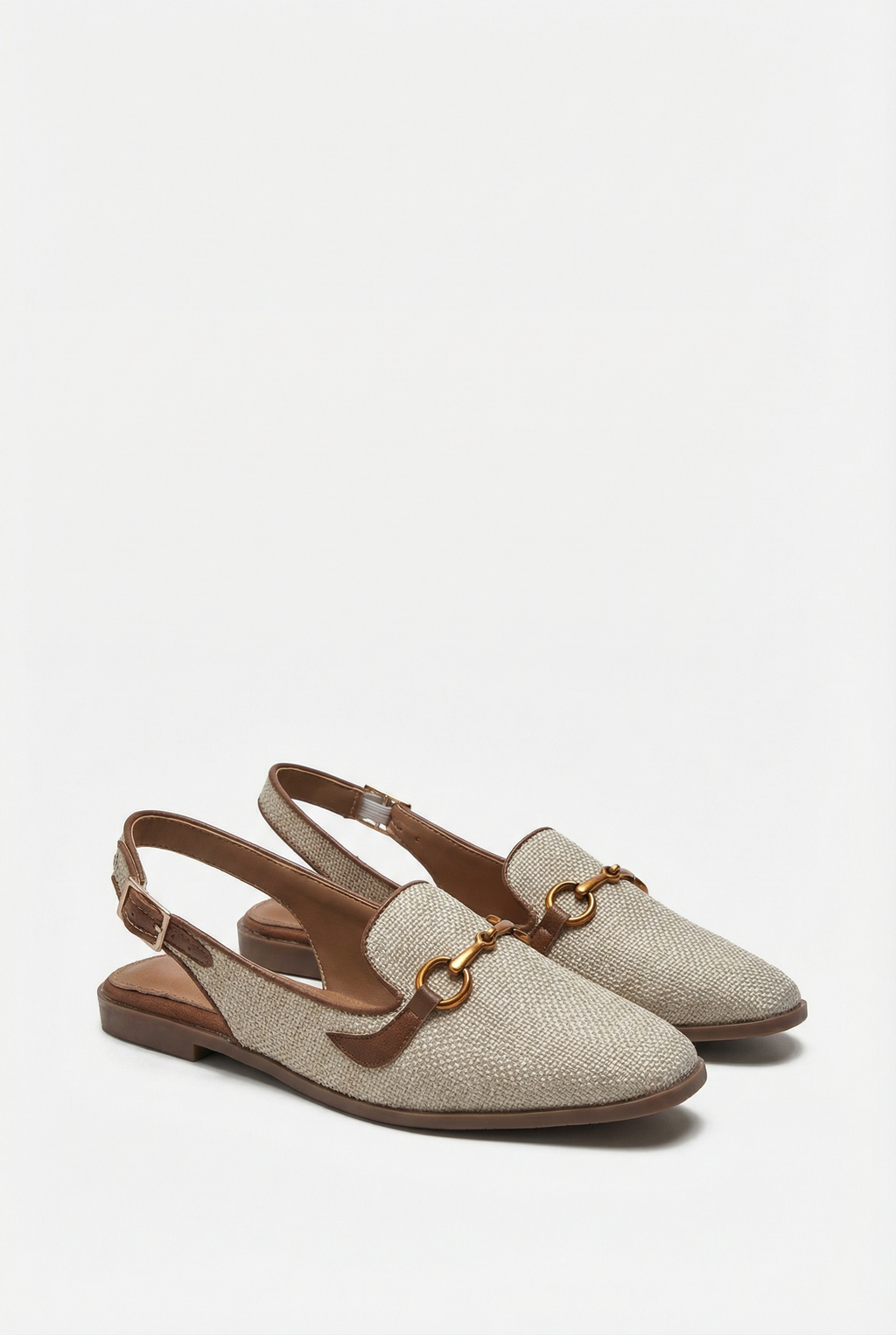 Women's closed-toe wedge flats with adjustable strap, front view