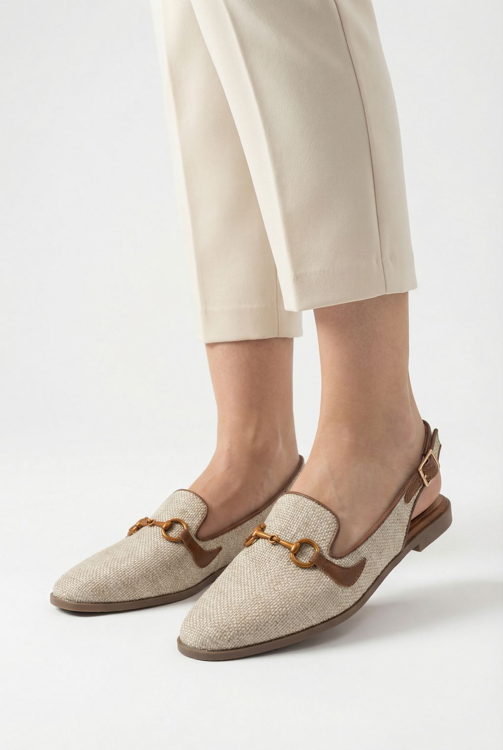 Women's wedge flats styled with smart-casual outfit, full length