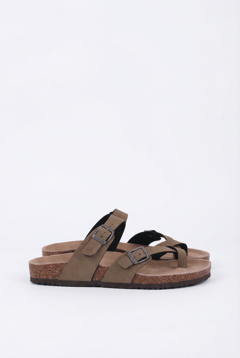 Women's suede mules, side view showing cork sole and arch support