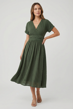 Women's pleated waist midi dress, side view showing flared skirt