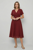 Women's pleated skirt midi dress, skirt movement close-up