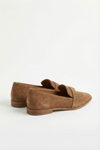 Women's cushioned loafers styled with trousers, full length
