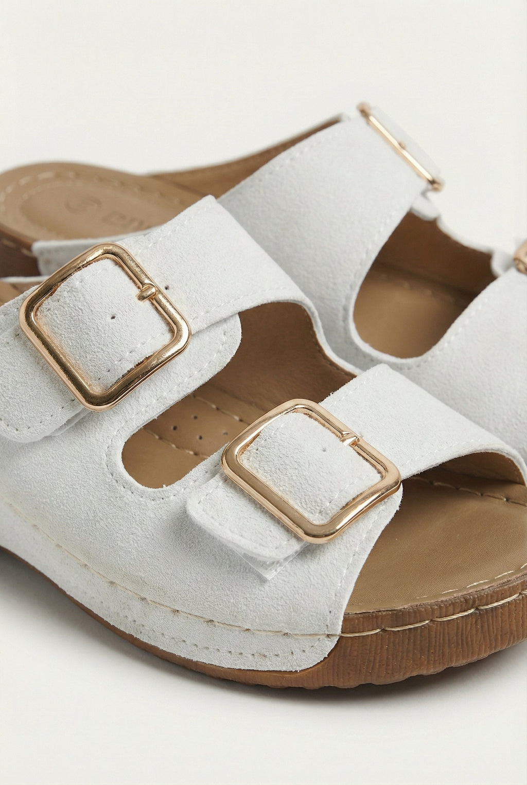 Women's lightweight wedge sandals styled with a dress, full length