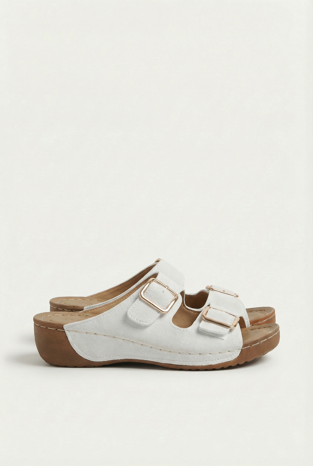 Women's slip-on sandals with wedge heel, side view showing height