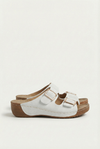 Women's slip-on sandals with wedge heel, side view showing height