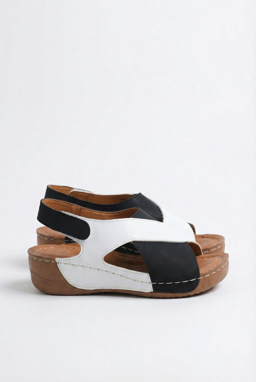 Women's slingback sandals, side view showing contoured footbed