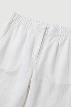 Women's lightweight trousers styled with a blouse, full length