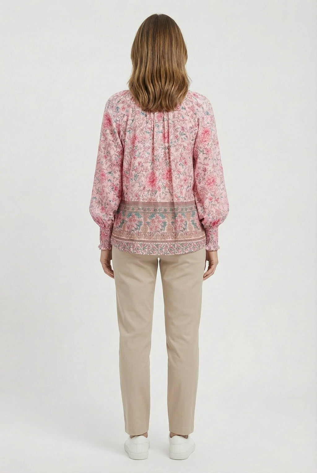 Women's relaxed fit top, close-up of neckline and fabric