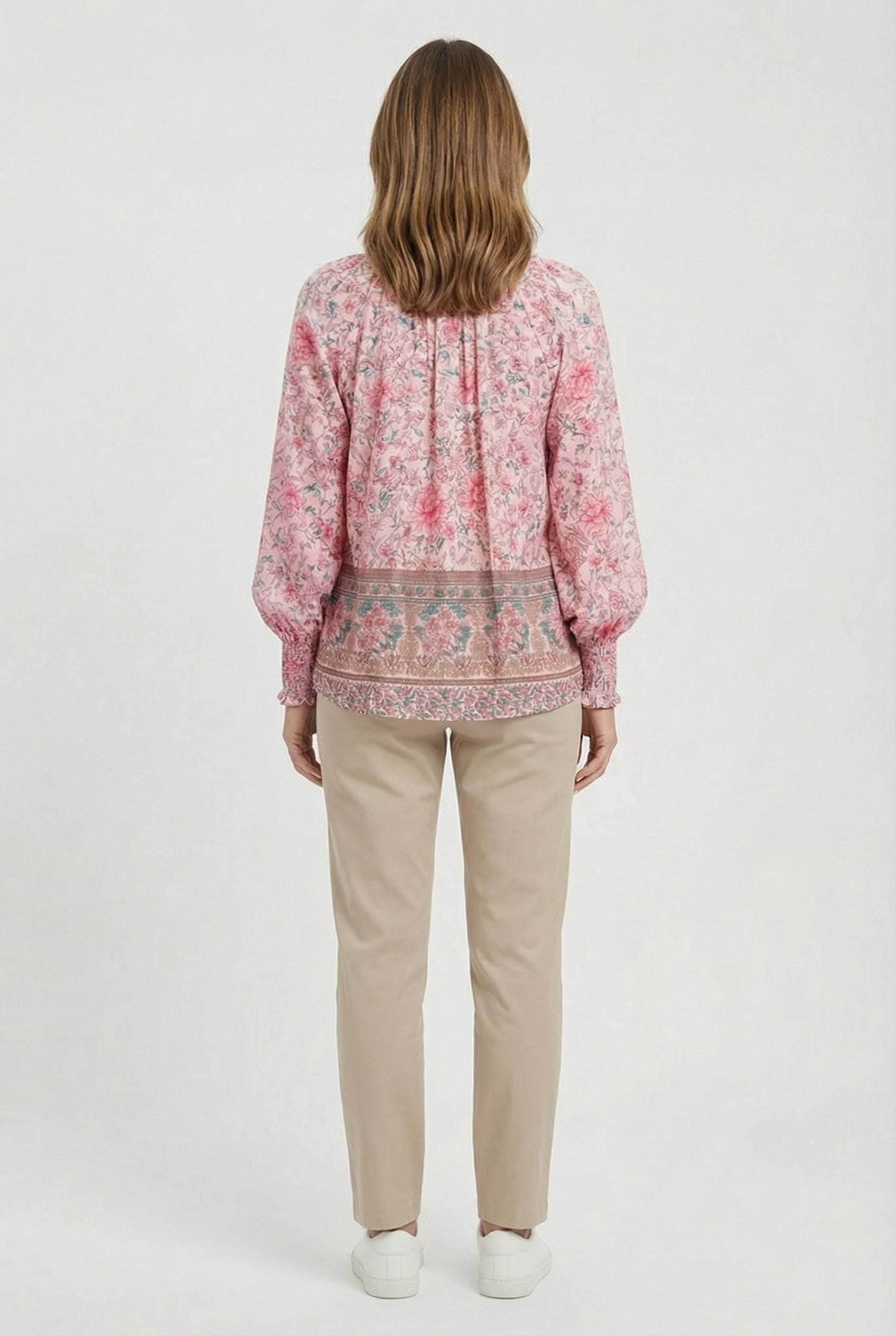 Women's relaxed fit top, close-up of neckline and fabric