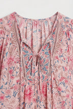 Women's classic silhouette top, side view showing drape
