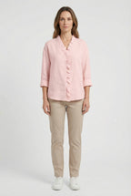 Women's long sleeve blouse with ruffle front, side view