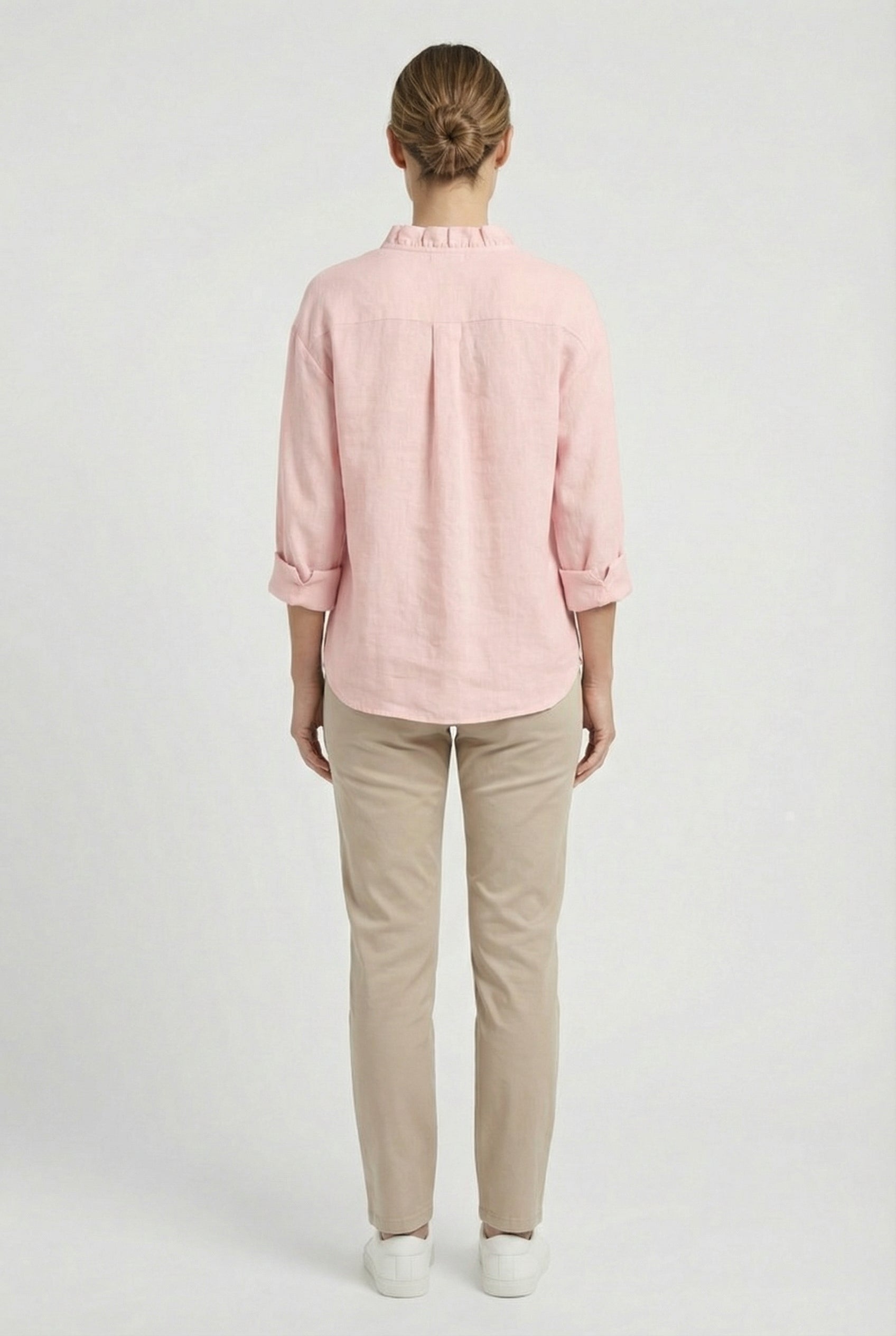 Women's relaxed fit ruffle blouse styled with trousers