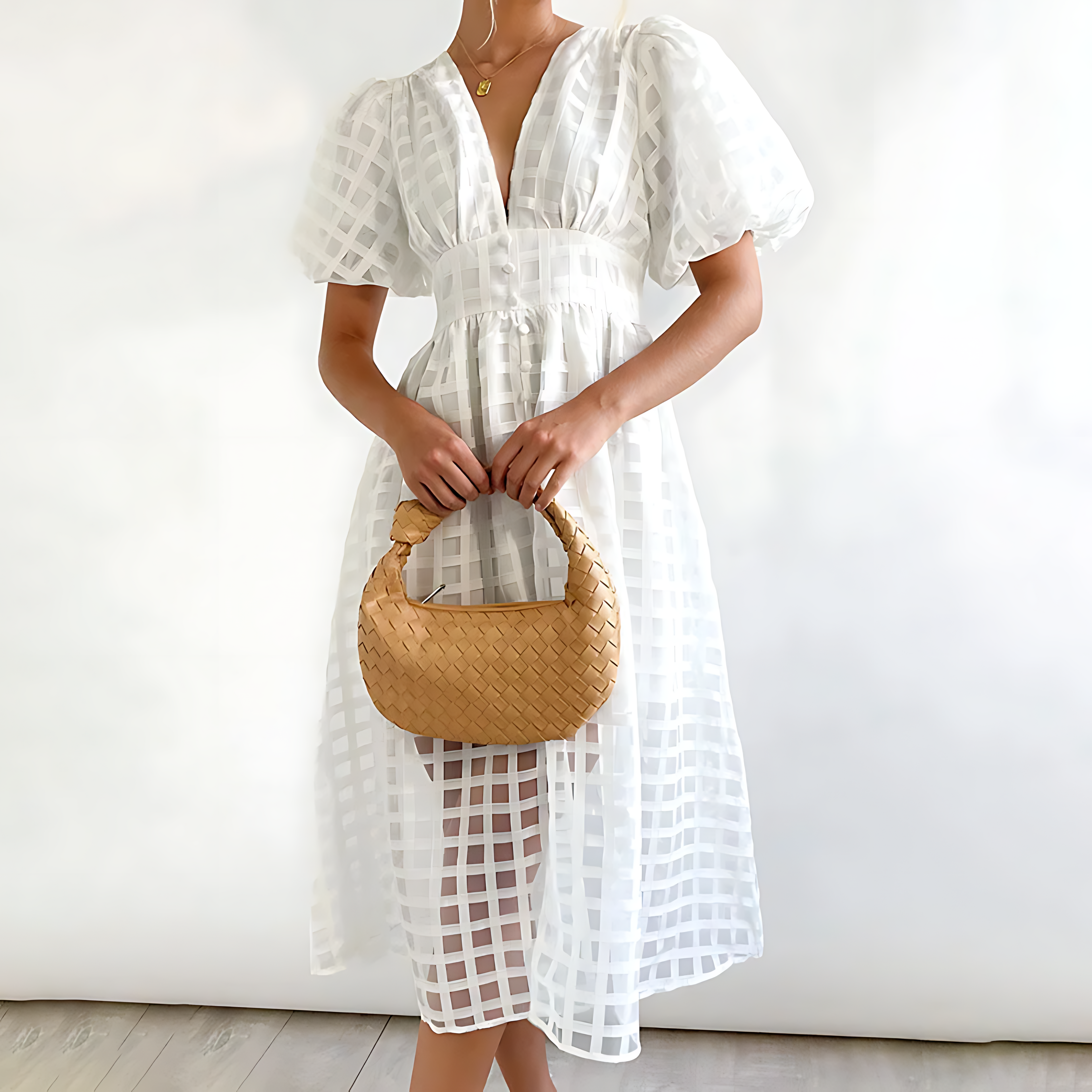 Women's retro-inspired puff sleeve midi dress showing bold square pattern detail
