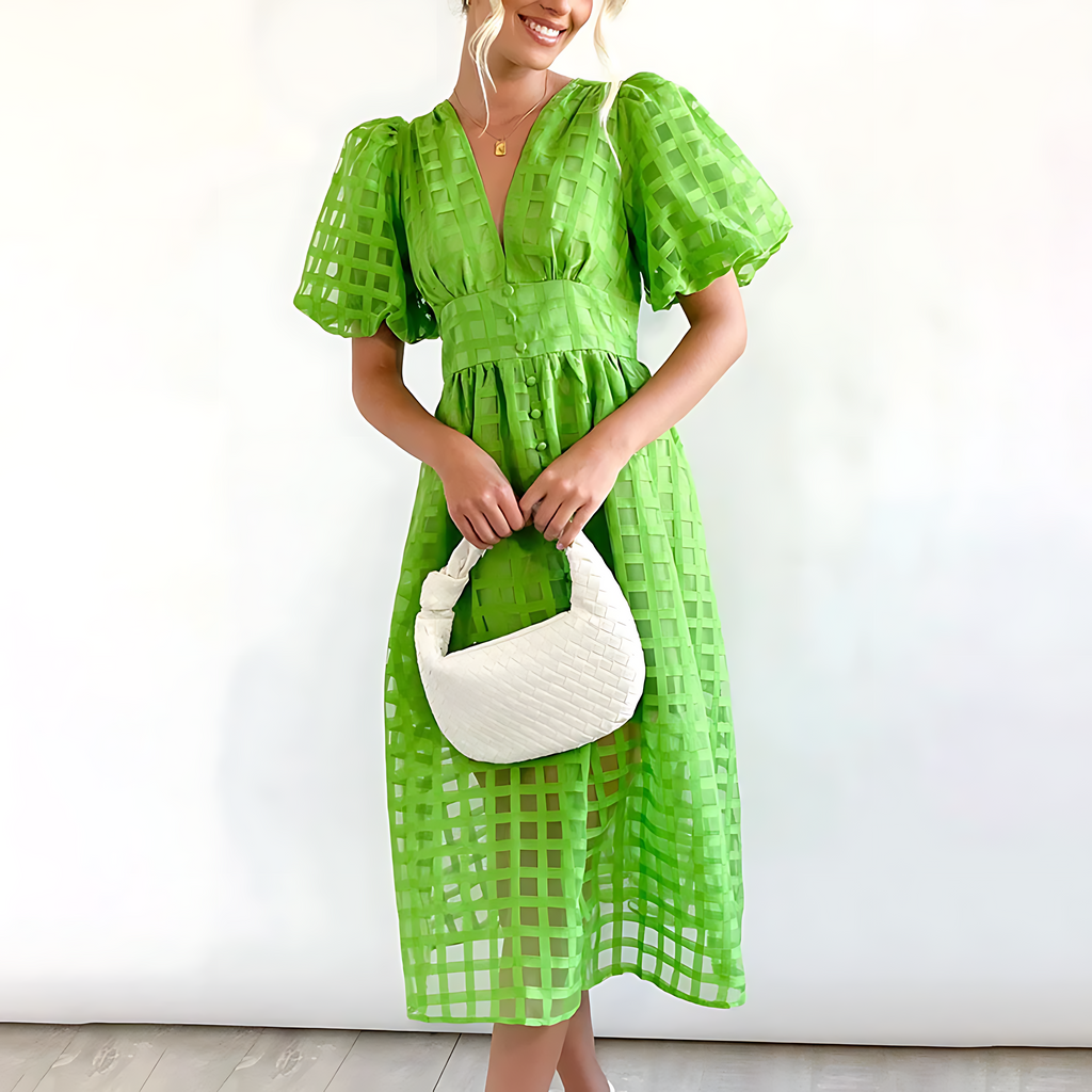 Women's puff sleeve wedding guest midi dress with bold pattern, back view