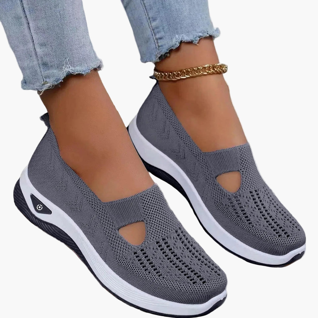Women's slip-on trainers pair angled view
