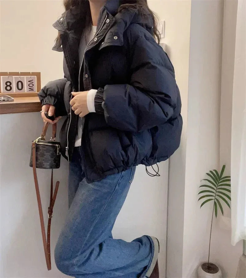 High neck quilted hooded puffer jacket with a zip up front