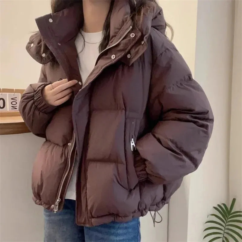 High neck quilted hooded puffer jacket with a high neck design