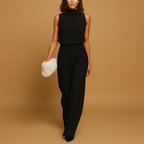 Black halter neck wide leg jumpsuit for women – decorative bow detail
