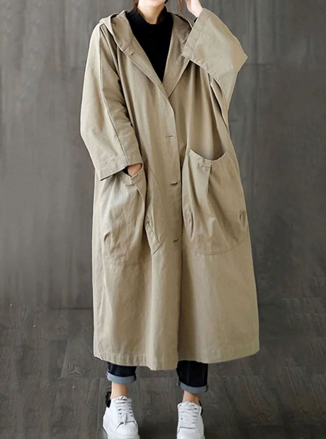 Oversized hooded water repellent flared trench coat with a water repellent finish