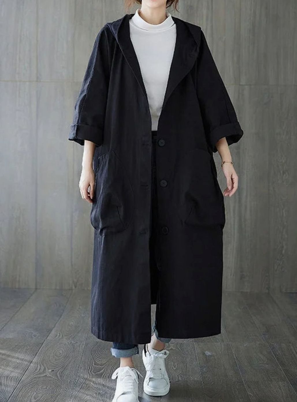 Oversized hooded water repellent flared trench coat with an attached hood