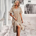 Floral V-neck ruffle sleeve A-line wedding guest midi dress in apricot, elegant front view