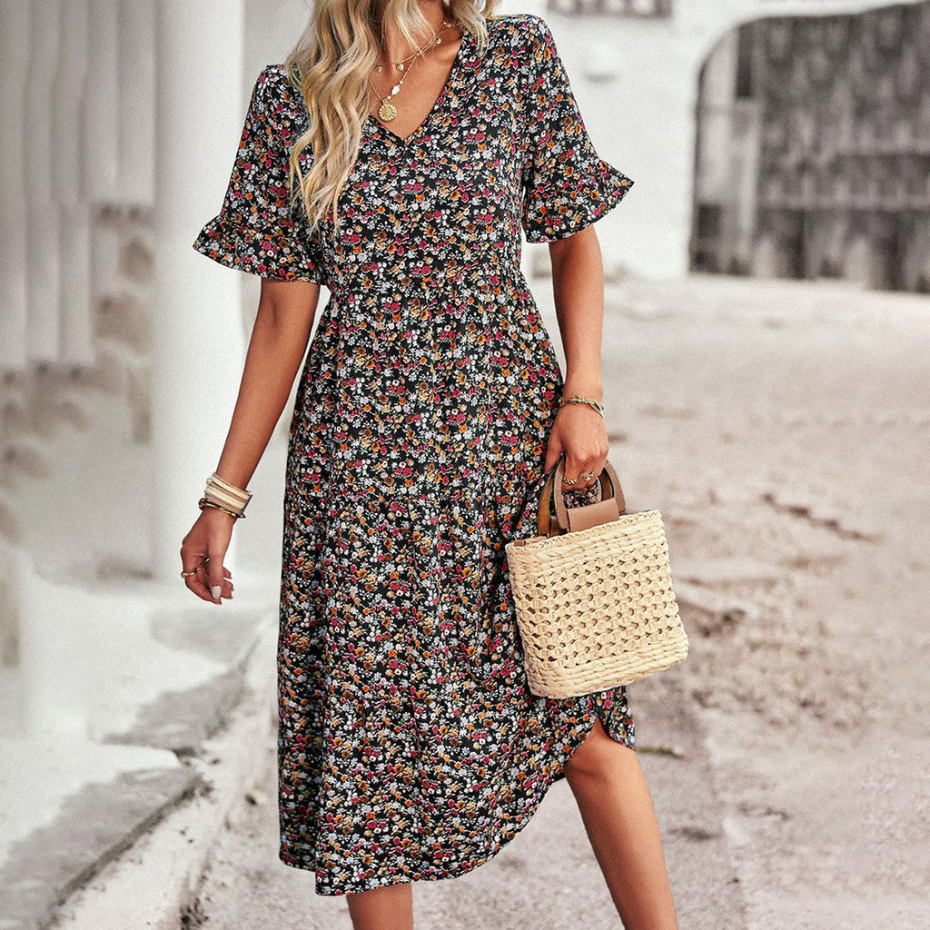 Ruffle sleeve floral midi dress showing flowing A-line skirt, side view