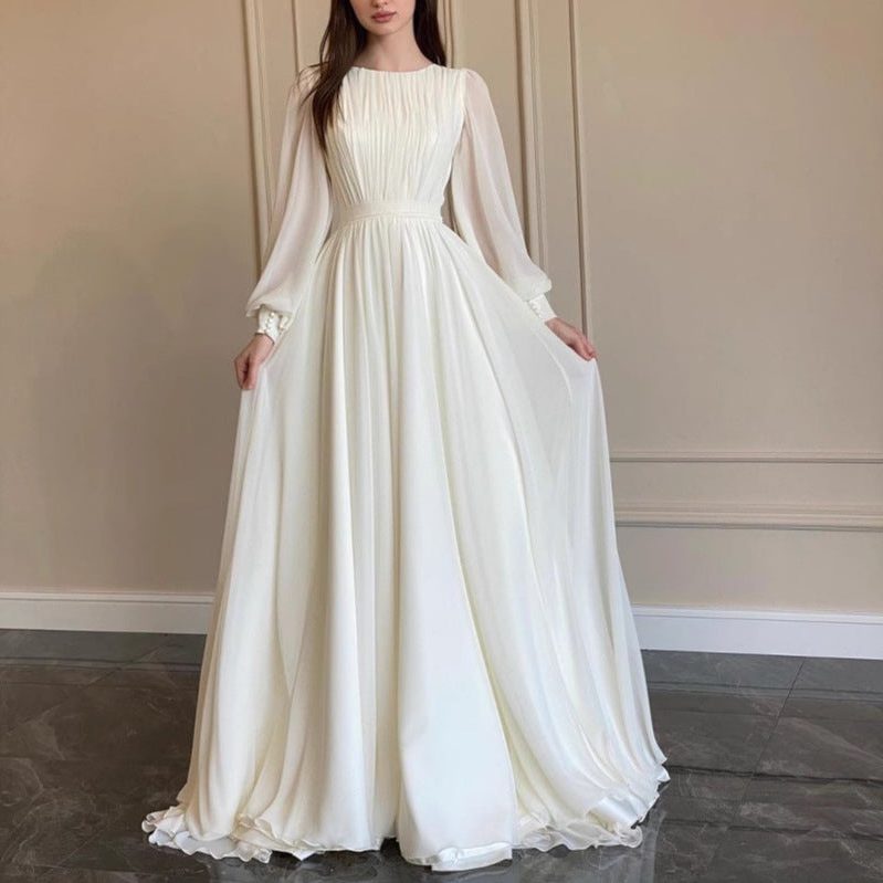 Blue long sleeve pleated wedding guest dress, front view